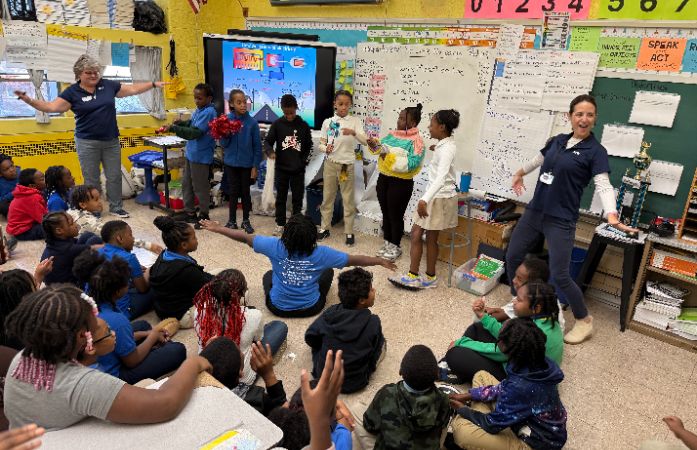 4th graders in their classroom learning about energy with guest from DTE